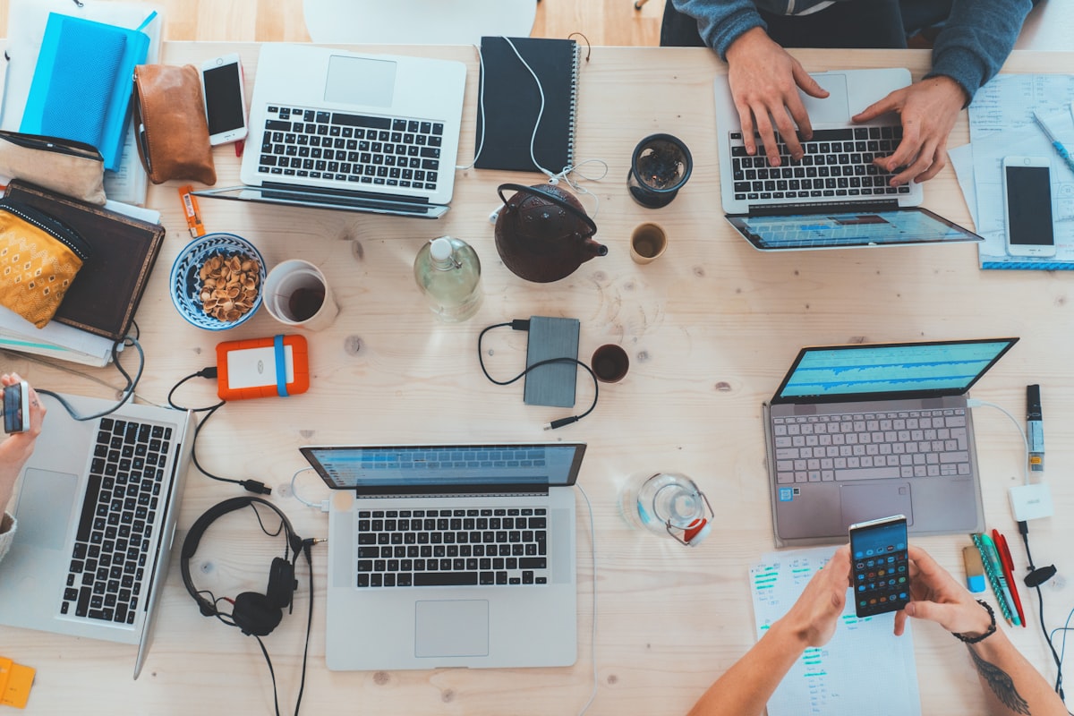 Digital team working on laptops and mobile devices