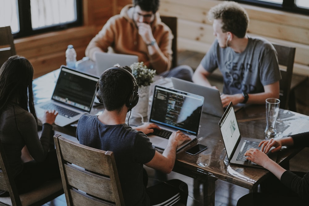 Software development team using laptops